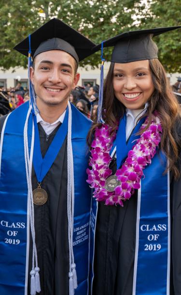 Two Graduated Students Smiling