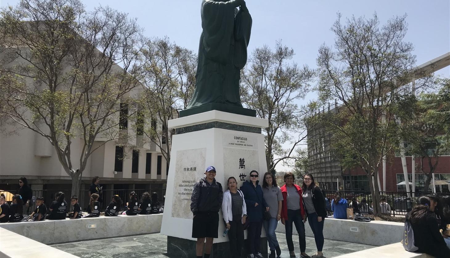 Students in Front of a Statue