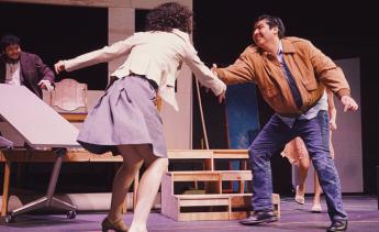 Student actors rehearsing Three Sisters on stage.
